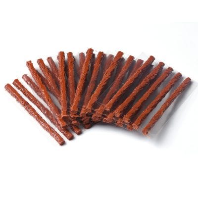 Thin, crispy beef jerky strips arranged in a fan shape on a white background. Perfect for healthy snacks, protein, and meat lovers. Affordable, high-quality jerky available at Monalisa Store.