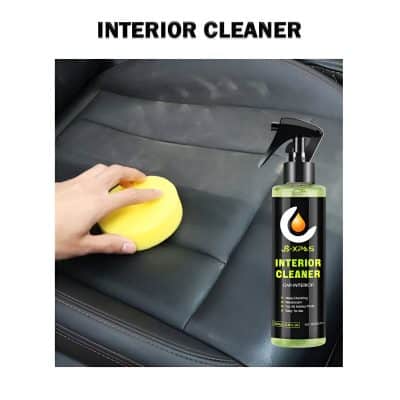 Aerosol interior cleaner spray and yellow sponge cleaning car leather seat, removing dirt and stains, promoting a clean and fresh vehicle interior.