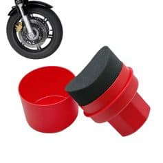 Red motorcycle tire cleaning sponge and scraper for vehicle maintenance.