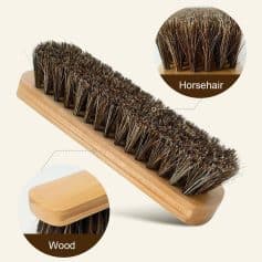Horsehair shoe brush with wooden handle for cleaning and polishing footwear. Ideal for maintaining the appearance of leather shoes and boots. Durable and effective for shoe care.