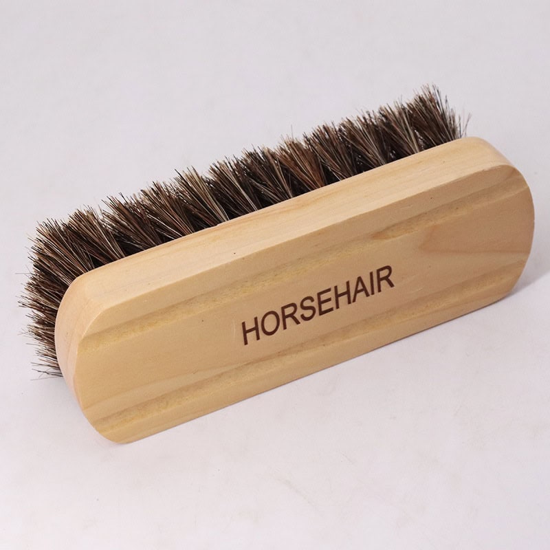 Horsehair shoe brush for cleaning and polishing footwear, natural bristle detailing for premium shoe care, durable wooden handle labeled "HORSEHAIR" ideal for shoe maintenance and grooming.