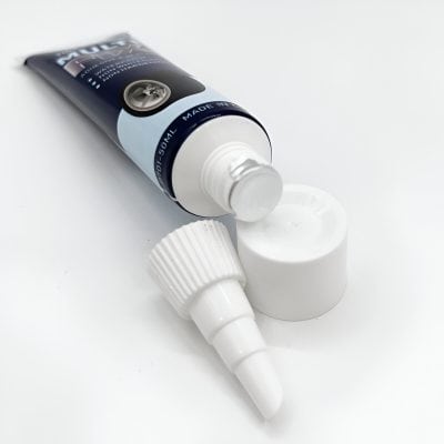Silver nitrate eye drops in a white plastic bottle, used in ophthalmology for eye care treatments. The bottle's cap and dropper are also visible, designed for precise application.