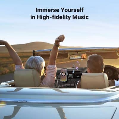 Young woman and man, enjoying high-fidelity music in a convertible car during sunset, with a smartphone playing music, on a scenic open road, capturing lifestyle and audio entertainment.