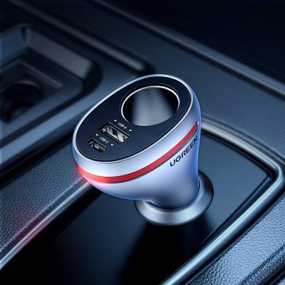 Portable car charger with multiple USB ports and LED indicator, compatible with smartphones and devices, designed for on-the-go charging and convenience.