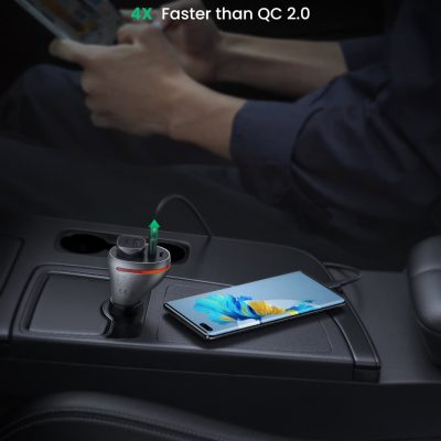 QC 3.0 fast charging port and modern smartphone on car dashboard, emphasizing quick device power-up technology.