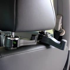 Headrest monitor mounts attached to vehicle seats, designed for in-car entertainment and monitoring systems. Suitable for transport services or commercial vehicles seeking integrated screen solutions.