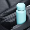 Recyclable turquoise insulated water bottle in car cup holder for eco-friendly hydration solutions.