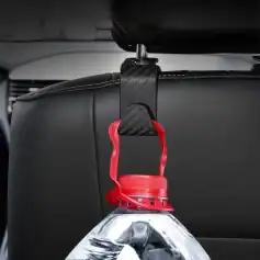 Bottle holder for car headrest with red strap and carbon fiber bracket, designed for easy access to water bottles during travel, enhancing convenience and hydration on the go.