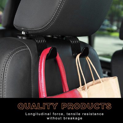 Double black car headrest hooks with rugged carbon fiber design, holding handbags securely, designed for durability and strength to prevent bag falling during car rides.