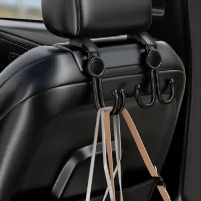 Backseat car organizer hooks with straps on the back of a vehicle seat for convenience and storage, ideal for hanging accessories, bags, or clothing during travel.