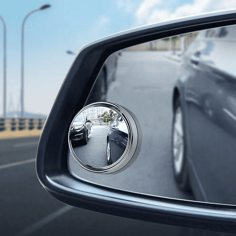 Reflective side mirror with a turn signal indicator, showing the view of other vehicles on the road. Ideal for automotive accessories and car safety enhancements.