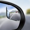 High-quality car side mirror showing vehicles on a scenic mountain road, emphasizing driving safety and vehicle visibility.