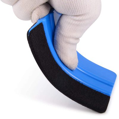 Flexible blue orthotic toe separator with adjustable strap for toe alignment and pain relief.