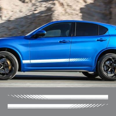 A sleek blue sports car driving on a mountain road, showcasing modern automotive design and high performance.