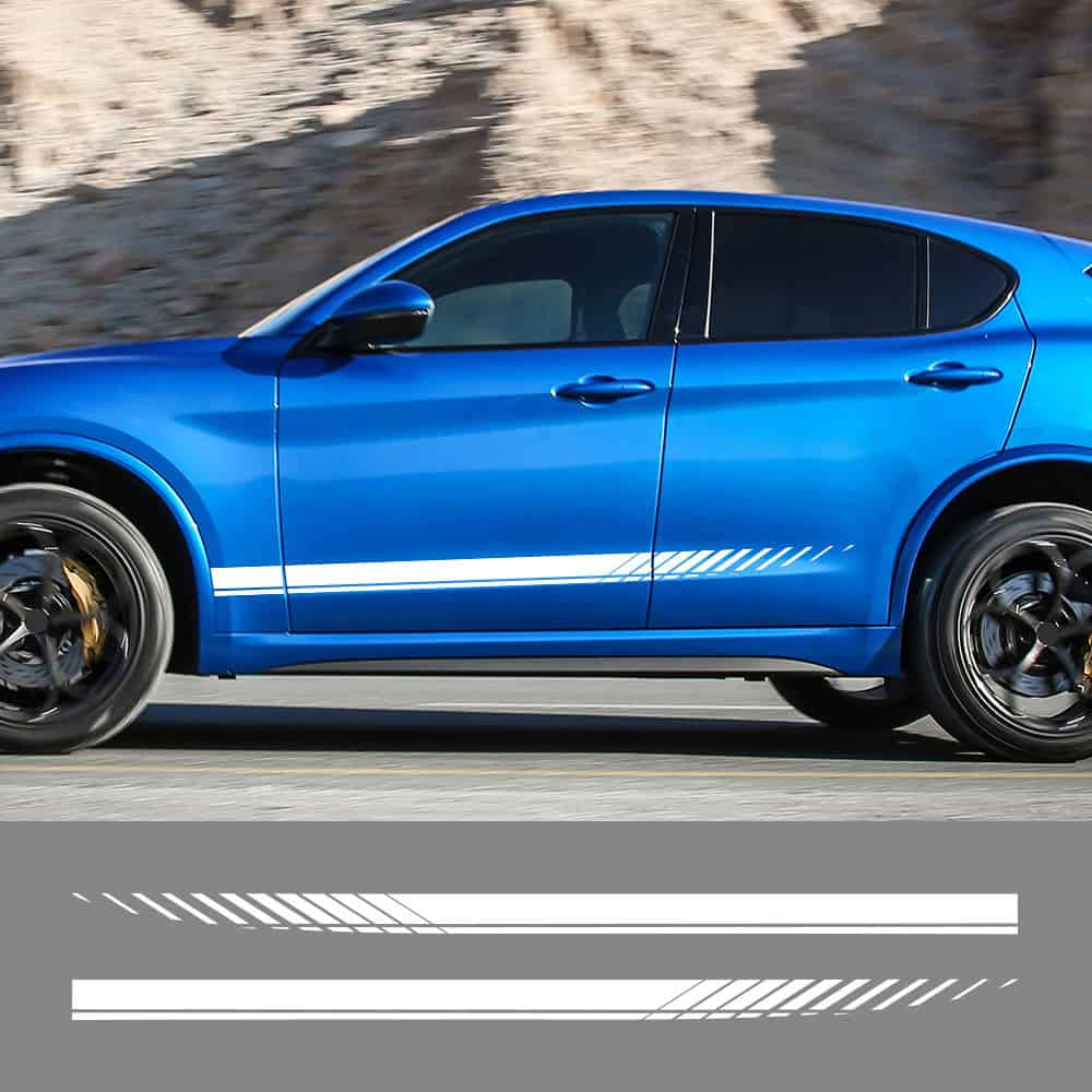 A sleek blue sports car driving on a mountain road, showcasing modern automotive design and high performance.