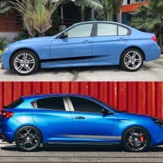 Blue BMW sedan with custom decals, stylish exterior design, high-performance alloy wheels, parked outdoors.