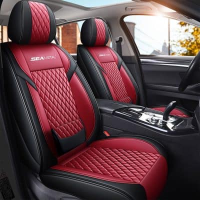 Red quilted leather car seat covers with black accents, custom-fit for luxury vehicles, offering comfort and style for drivers and passengers.