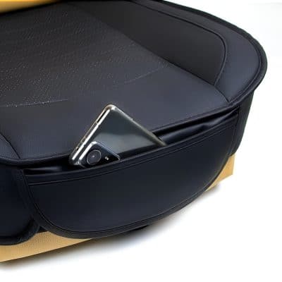 Wireless charging smartphone in the pocket of a sleek, modern massage chair at Monalisa Store, emphasizing comfort, convenience, and ergonomic design for optimal eye care and optometry services.