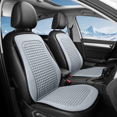 Gray and black car seat covers with textured pattern inside a vehicle with mountain view in the background.