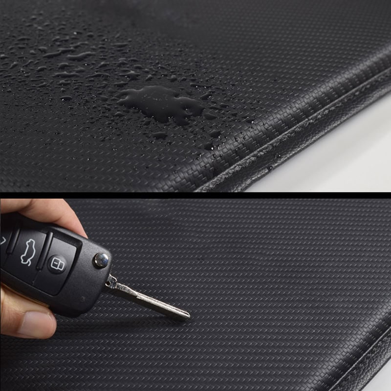 Water-resistant car dashboard mat with textured surface for protection and durability and a close-up of a car key on the mat, emphasizing its suitability for vehicle interior accessories.