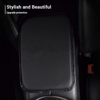 Black leather car armrest with textured pattern and sleek design for vehicle interior comfort and style.