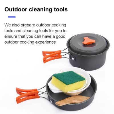 Non-slip outdoor cooking skillet with orange handles and cleaning sponge set for camping and outdoor activities.