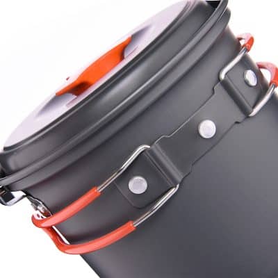 Durable black camping pot with orange and silver handles, ideal for outdoor cooking and travel.