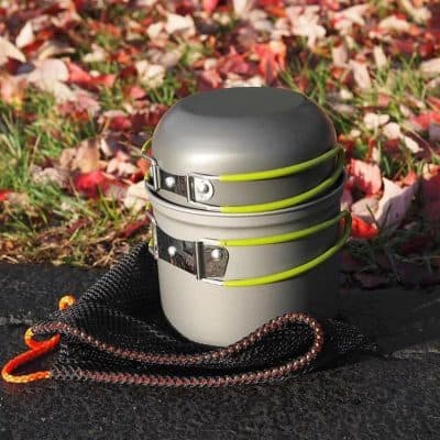 Portable camping stove with foldable design and safety latch for outdoor cooking and hiking. Compact and lightweight for easy transport and storage. Ideal for outdoor enthusiasts and adventurers.