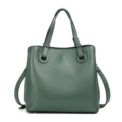 Luxurious green leather handbag with sturdy handles and adjustable shoulder strap, stylish and versatile accessory for women. Great for work, daily use, or travel.