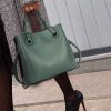 Elegant green leather handbag from Monalisa Store, perfect for fashion-forward individuals seeking stylish accessories. Ideal for casual and formal occasions.
