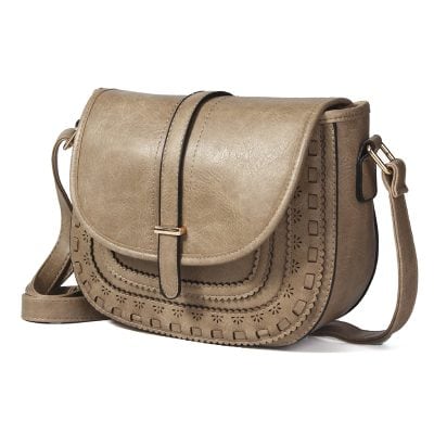 Elegant beige leather handbags for women with intricate cutout designs, stylish and versatile accessories for daily use and fashion statements.