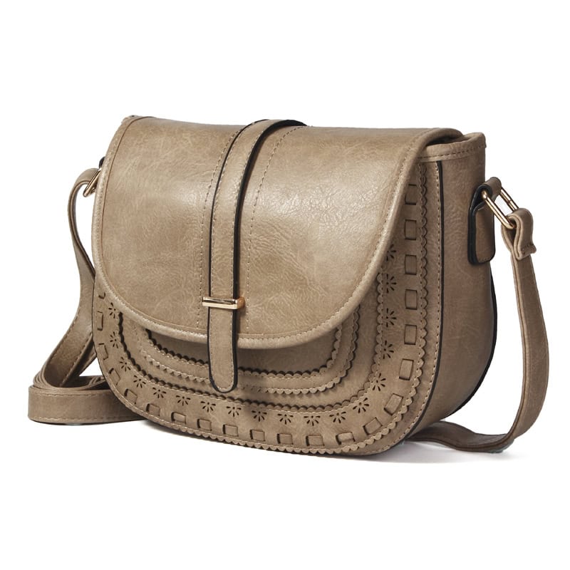 Elegant beige leather handbags for women with intricate cutout designs, stylish and versatile accessories for daily use and fashion statements.