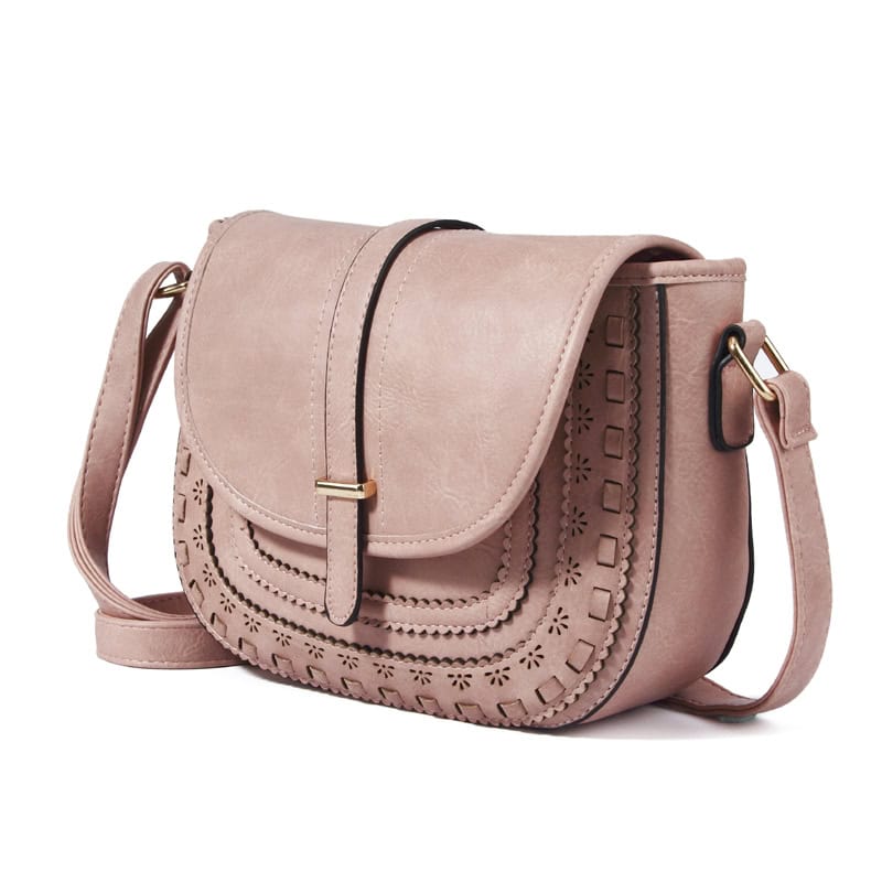 Elegant pink leather crossbody shoulder bag with decorative cutout details and adjustable strap, perfect for casual and formal occasions.