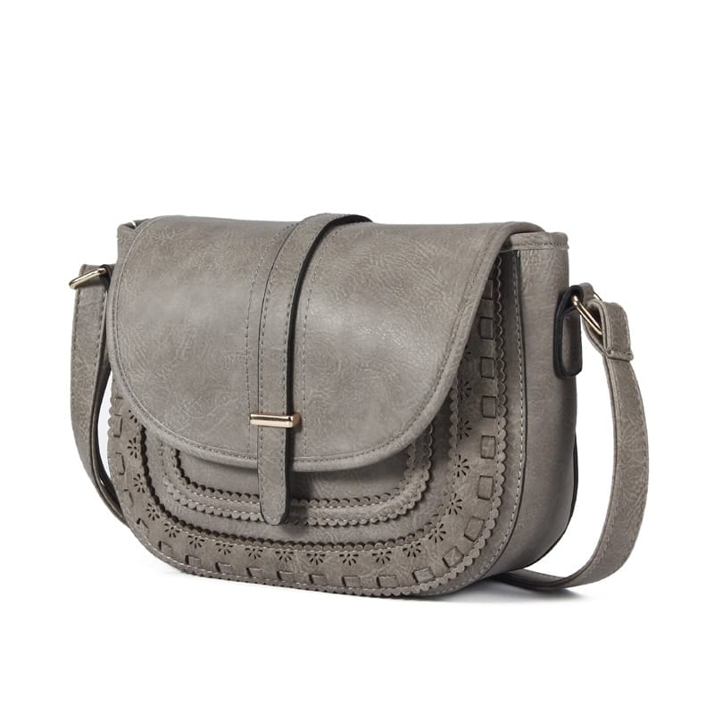 Stylish gray leather shoulder bag with intricate cutout design, perfect for casual or formal occasions, combining elegance and functionality for everyday use.