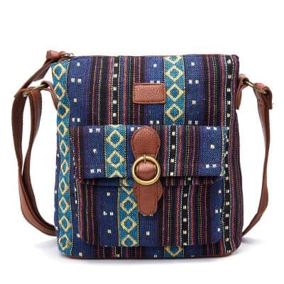 Colorful woven fabric shoulder bag with leather strap and gold ring detail, perfect for stylish accessories and casual outings.