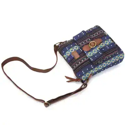Colorful woven fabric shoulder bag with leather accents and adjustable strap, perfect for casual wear.