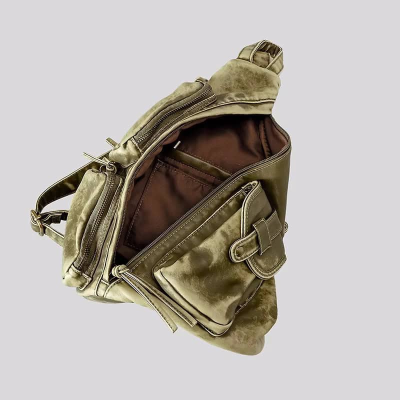 Water-resistant olive green leather backpack with multiple compartments for travel and daily use.