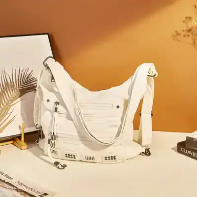 Stylish white designer handbag with multiple zippered compartments, perfect for fashion-forward individuals seeking high-quality accessories at Monalisa Store.