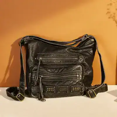 Stylish black leather crossbody bag with multiple zippered compartments, ideal for everyday use and travel.