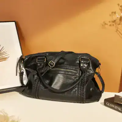 Luxurious black leather handbag with multiple zippered compartments, stylish design, and sturdy straps, ideal for fashion-forward women seeking premium accessories at Monalisa Store.