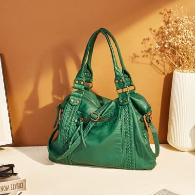 Bright green stylish leather handbag with braided details and gold accents, perfect for fashion-conscious women. Suitable for casual outings or evening events, combining elegance and practicality.