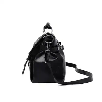 Stylish black leather designer handbag with adjustable shoulder strap, perfect for everyday use and fashion-forward accessories.