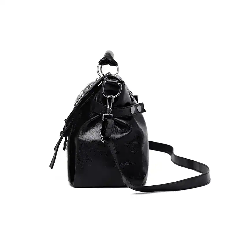 Stylish black leather designer handbag with adjustable shoulder strap, perfect for everyday use and fashion-forward accessories.