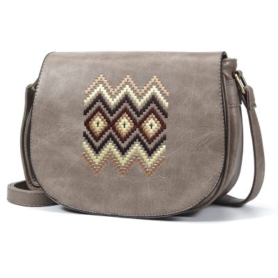 Handcrafted faux leather crossbody bag with embroidered geometric design, perfect for stylish women seeking high-quality accessories for everyday use.