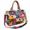 Multicolored patchwork leather handbag with top handles and shoulder strap, fashionable women's accessories from Monalisa Store.