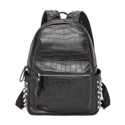 Stylish black crocodile-embossed leather backpack with silver studs, ideal for fashion-forward students and professionals, blending luxury with functional design.