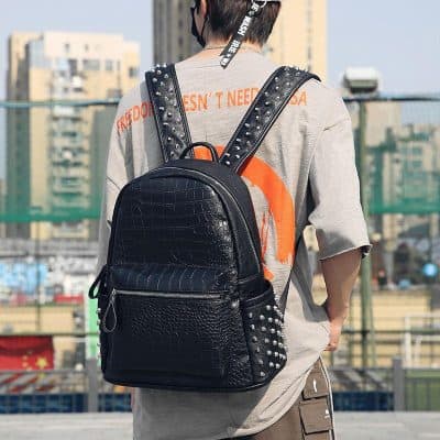 Black leather backpack with silver studs, trendy accessories for school or casual outings at Monalisa Store.