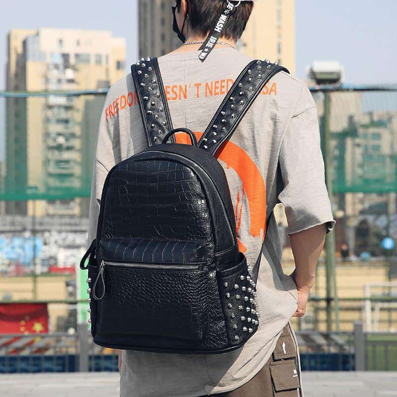 Black leather backpack with silver studs, trendy accessories for school or casual outings at Monalisa Store.