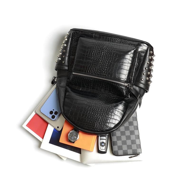 Luxurious black crocodile-pattern leather backpack with metal studs, perfect for stylish accessories and daily use.