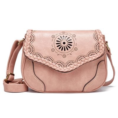 Vegan leather pink shoulder bag with laser-cut floral design, braided strap, and stylish details, ideal for fashionable accessories and casual wear.